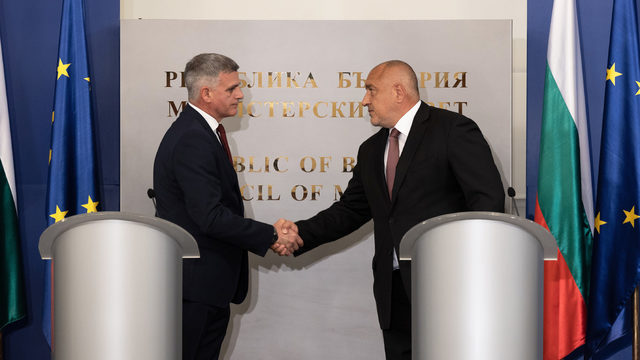 Outgoing Prime Minister Boyko Borissov (right) passes the baton to Stefan Yanev