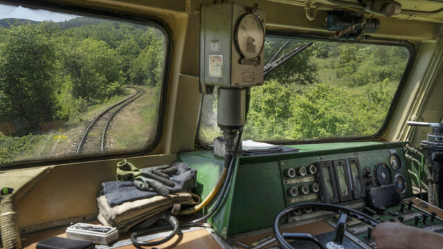 The view from a 1965 Henschel locomotive, part of the batch of 10 narrow-gauge specific engines put into service that same year. The Septemvri-Dobrinishte route was one of three lines using the 760mm gauge, which was well-adapted to the challenging mountain terrain (and necessary for making the sharp turns along the route). The other two lines (a total of 136 km) were closed down in 2002 for economic reason, leaving the existing line the last narrow gauge line in Bulgaria. The view from a 1965 Henschel locomotive, part of the batch of 10 narrow-gauge specific engines put into service that same year. The Septemvri-Dobrinishte route was one of three lines using the 760mm gauge, which was well-adapted to the challenging mountain terrain (and necessary for making the sharp turns along the route). The other two lines (a total of 136 km) were closed down in 2002 for economic reason, leaving the existing line the last narrow gauge line in Bulgaria.