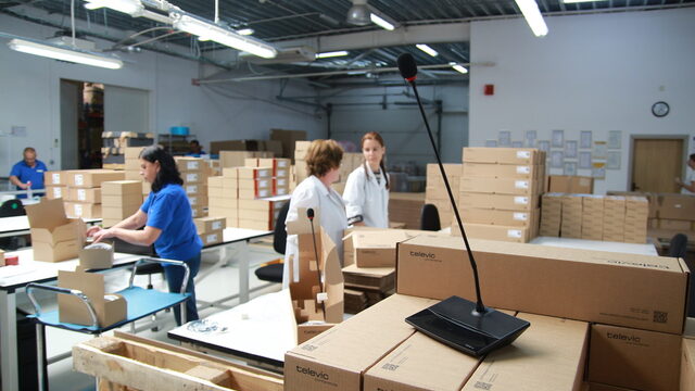Employees pack products that will go on their way to Europe and the world