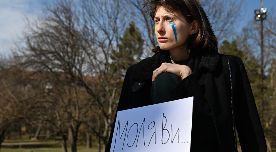 Protest of a girl in front of The Monument to the Soviet Army in Sofia